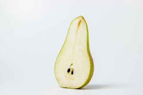 Isolated pear on a white background. Pear cut in half.  Stock Photos