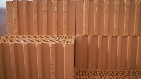 Isolated pile of builders bricks. Ceramic blocks stack 動画素材 119358894