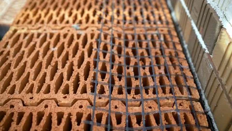 Isolated pile of builders bricks. Ceramic blocks stack Stock Photos
