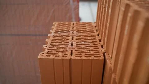 Isolated pile of builders bricks. Ceramic blocks stack 写真素材