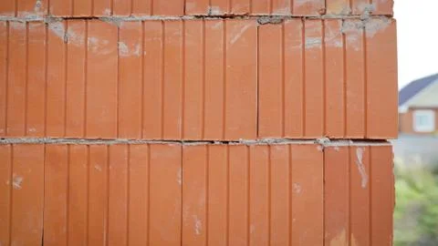 Isolated pile of builders bricks. Ceramic blocks stack Stock Photos