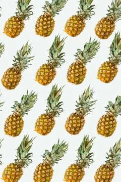 Isolated pineapples pattern or wallpaper on white background Stock Photos