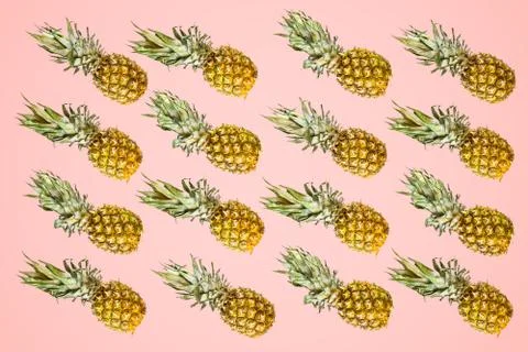 Isolated pineapples pattern on  pale red background Stock Photos