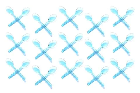 Isolated plastic spoons on background Stock Photos