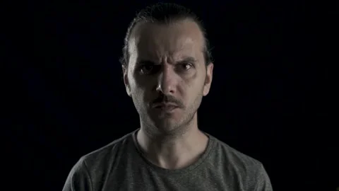 Isolated portrait of aggressive handsome guy is screaming. Angry white man's  Stock Footage 133415582