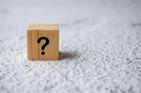 Isolated question mark on white marble background. Question and Answer concep Stock Photos