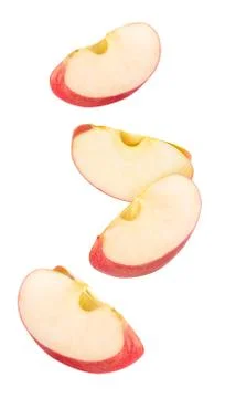 Isolated red apple pieces flying in the air Foto stock