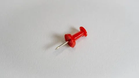 Isolated red push pin on a white background Stock Photos