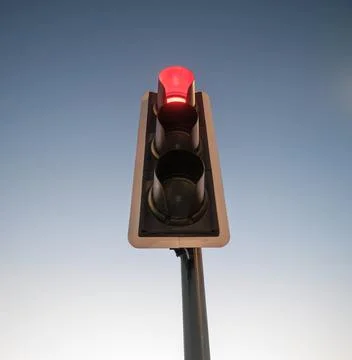 Isolated Red Traffic Light Against Sky Foto stock