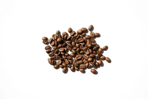 Isolated roasted coffee beans in harsh light Stock Photos