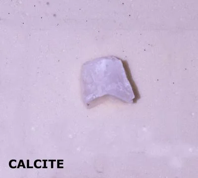 Isolated sample of a Calcite rock on texture background. Calcite Metamorphi.. Stock Photos
