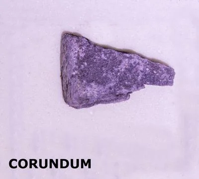 Isolated sample of a Corundum rock on texture background. Corundum Sediment.. Stock Photos