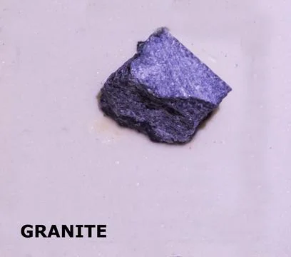 Isolated sample of a Granite rock on texture background. Granite Igneous Ro.. Stock Photos