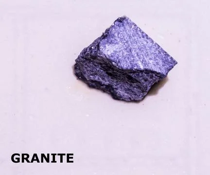 Isolated sample of a Granite rock on texture background. Granite Igneous Ro.. Фото