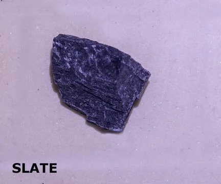 Isolated sample of a Gray Slate rock on texture background. Gray Slate Meta.. Stock Photos