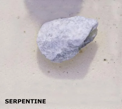 Isolated sample of a Serpentine rock on texture background. Serpentine Meta.. Stock Photos