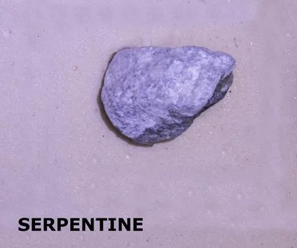 Isolated sample of a Serpentine rock on texture background. Serpentine Meta.. Stock-Fotos