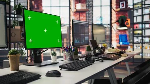 Isolated screen computer displays in customer support workplace, panning shot Stock Photos