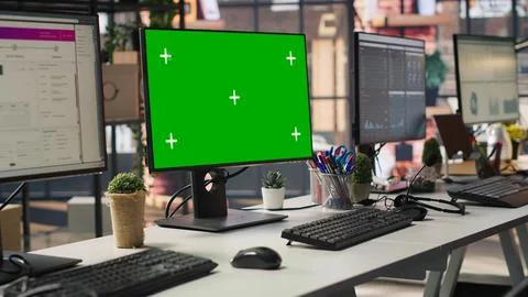 Isolated screen computer displays in customer support workplace, panning shot Stock Photos