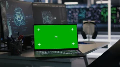 Isolated screen laptop and computer in data center overseeing server gear Stock Photos
