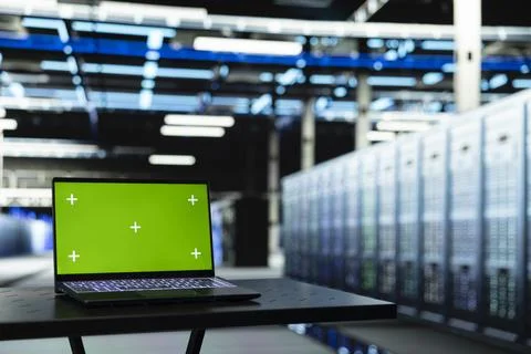 Isolated screen laptop in data center used to evaluate gear mainframes Stock Photos