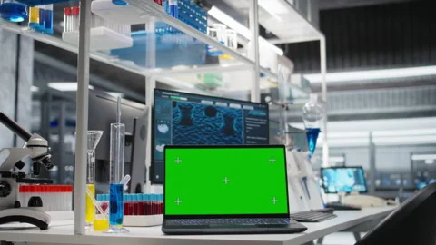 Isolated screen laptop in lab next to test tubes and microscope equipment Stock Footage 320725072