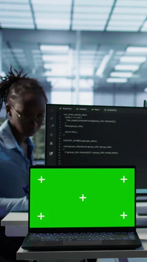 Isolated screen laptop next to programmer coding in server farm Stock Footage 319531686