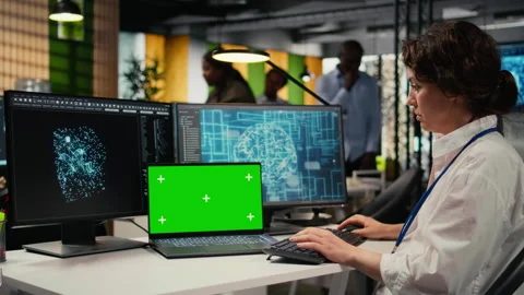 Isolated screen laptop used by engineer in startup office working with AI Stock Footage 323332552