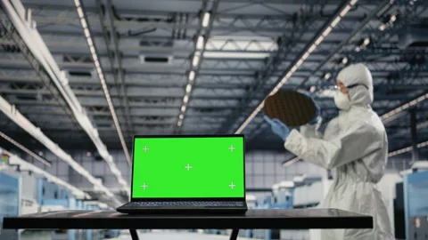 Isolated screen laptop used by microchip factory worker testing silicon wafers Stock Footage 333394432