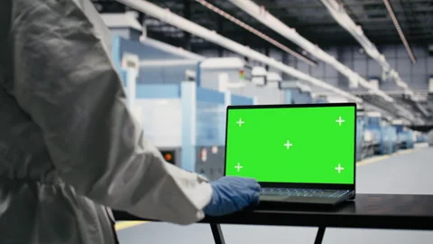 Isolated screen laptop used by technician to monitor microchip production Stock Footage 333391904
