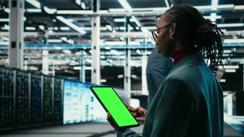 Isolated screen mockup tablet used by data center software developer coding Stock Footage 329452176