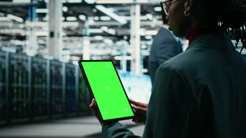 Isolated screen mockup tablet, writing code and developer in data center 動画素材 329650400