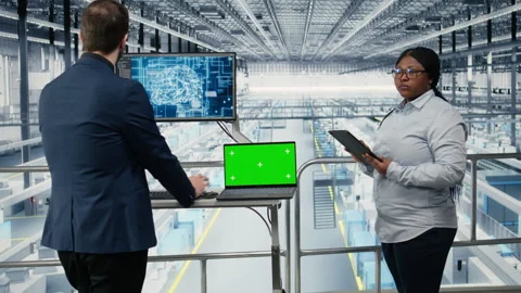 Isolated screen notebook used by colleagues monitoring semiconductors factory Stock Footage 333381180