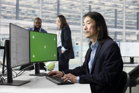 Isolated screen PC used by man in RD office modeling integrated circuit systems Stock Photos