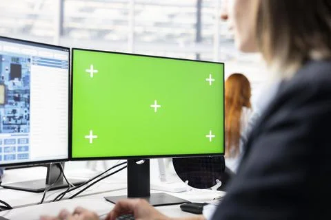 Isolated screen PC used by tech laboratory expert to configure PCB hardware Stock Photos