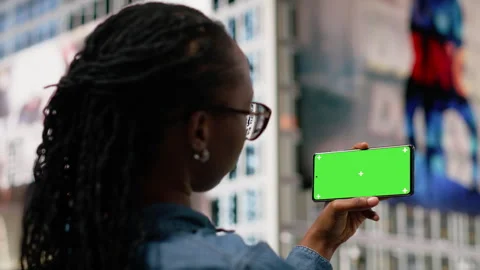 Isolated screen smartphone in landscape mode used by relaxed woman Stock Footage 334172713