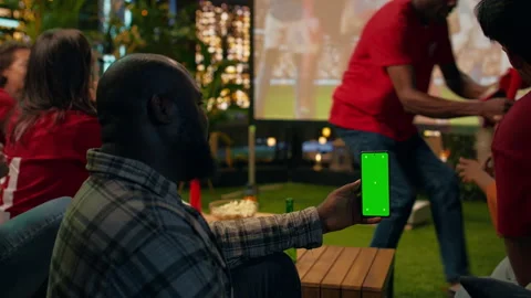 Isolated screen smartphone used by fan checking live scores on betting app Stock Footage 346781102