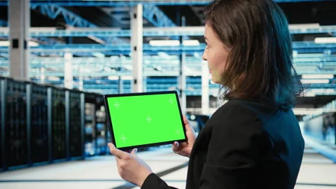 Isolated screen tablet in data center used by software developer Stock Footage 329323796