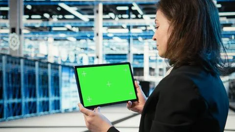 Isolated screen tablet in data center used by software developer Stock Photos