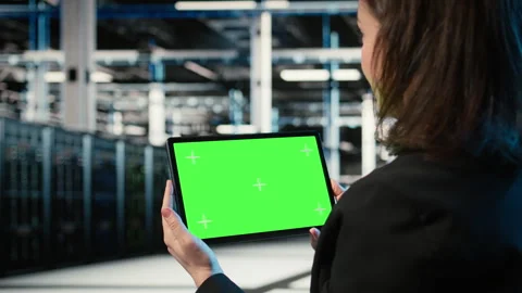 Isolated screen tablet, IT infrastructure and software developer in data center Stock Footage 329326562