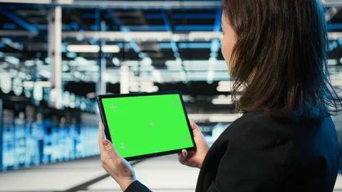 Isolated screen tablet, IT infrastructure and software developer in data center Stock Photos