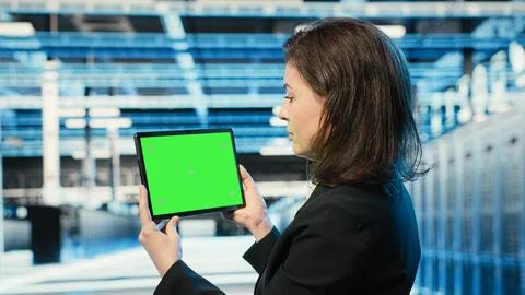 Isolated screen tablet, IT infrastructure and software developer in data center Stock Photos