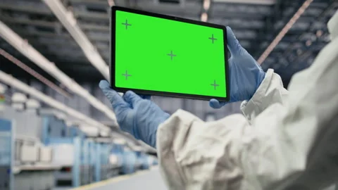 Isolated screen tablet used by cleanroom manager tracking semiconductors Stock Footage 333391945