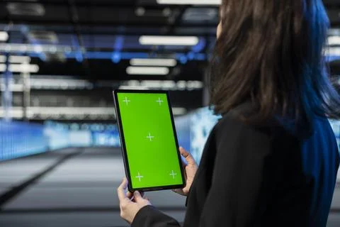 Isolated screen tablet used by data center manager to review diagnostics Stock Photos