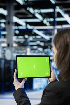 Isolated screen tablet used by data center admin to inspect infrastructure Stock Photos