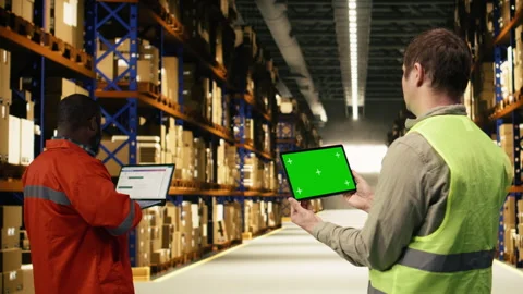 Isolated screen on tablet with warehouse staff member near cargo storage Stock Footage 332907560