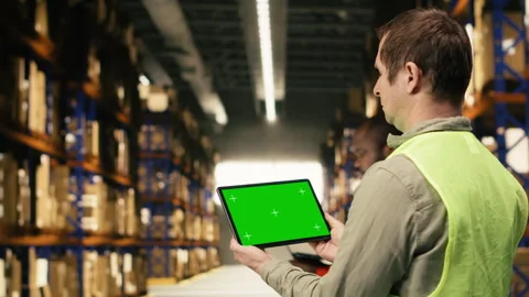 Isolated screen on tablet with warehouse staff member near cargo storage Stock Footage 332910014