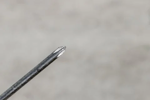 The Isolated Screwdriver with the Gray Ground Background Stock Photos