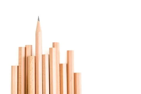 Isolated sharp pencil stand out of other brown pencils Stock Photos