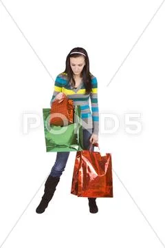 Isolated shot of a beautiful girl with shopping bags Stock Photos
